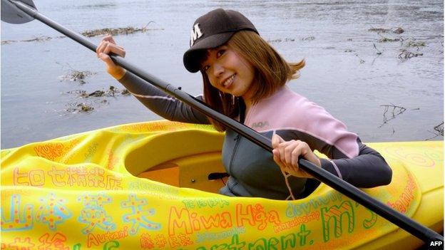 This handout picture taken by Rokudenashiko and Marie Akatani on 19 October 2013 shows artist Megumi Igarashi paddling a kayak designed to be the shape of her own vagina in Tokyo.