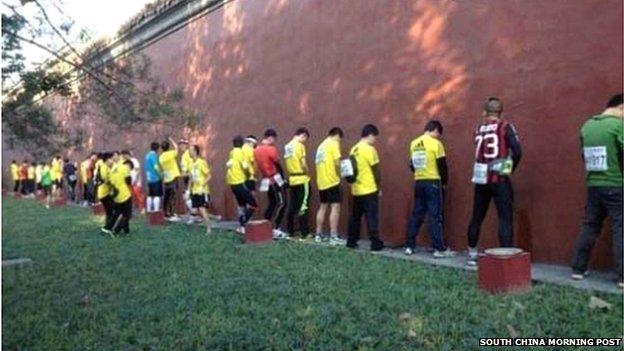 Runners in the 2013 Bejing Marathon seen urinating on the walls of the Forbidden City (file)