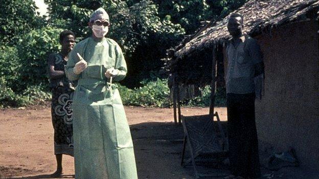 Peter Piot wearing protective gear in Yambuku, 1976