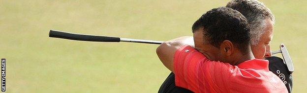 Tiger Woods of the United States hugs his caddy Steve Williams after winning the 135th British Open Golf Championships in Hoylake, in Liverpool, in north-west England in 2006.