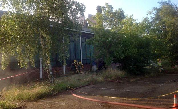 Firefighters checking for hot-spots at Pinebanks Centre