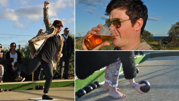 Young people playing bowls and drinking beer