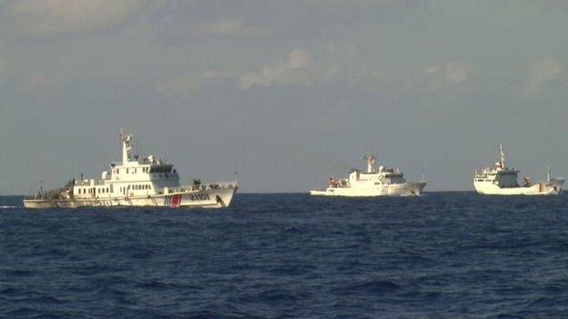 Pictures of two Chinese ships (L and C) and a Vietnamese boat (R).