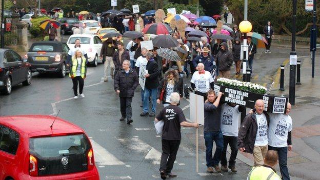 Traders stage mock funeral