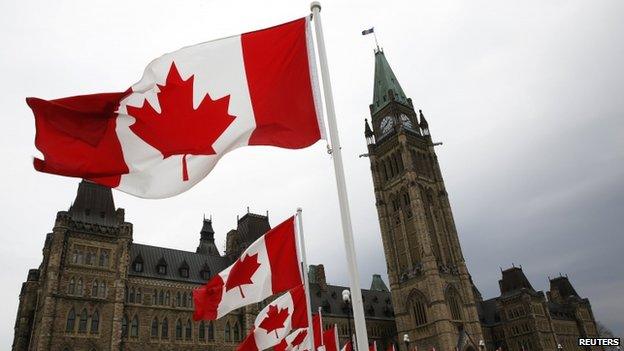 Canadian flags lined the road around Parliament Hill in Ottawa, Canada, on 9 May 2014