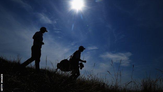 Justin Rose and caddie at Open