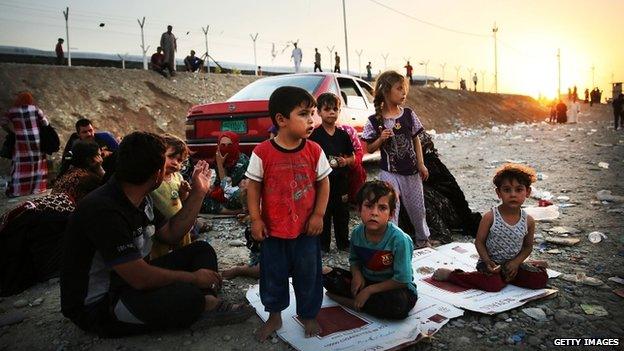 Refugees from Isis-held city of Mosul in Iraq prepare to sleep rough in a displacement camp