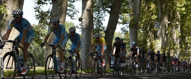 Race leader Vincenzo Nibali (in yellow jersey) rides in the slipstream of his Astana team-mates