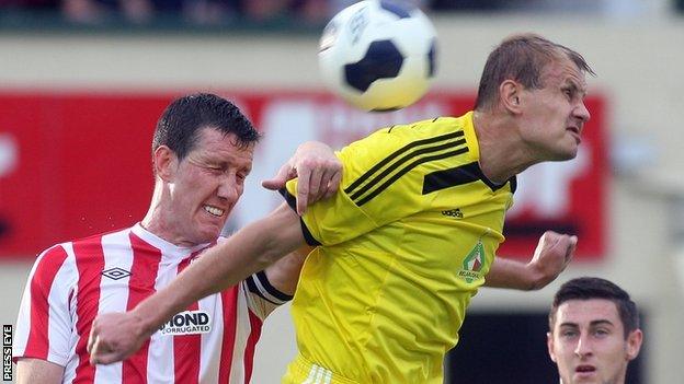 Cliff Byrne and Mikalai Kashewski in aerial action at the Brandywell