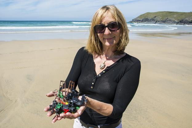 Tracey with Lego haul on beach