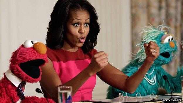 Michelle Obama with Sesame Street characters