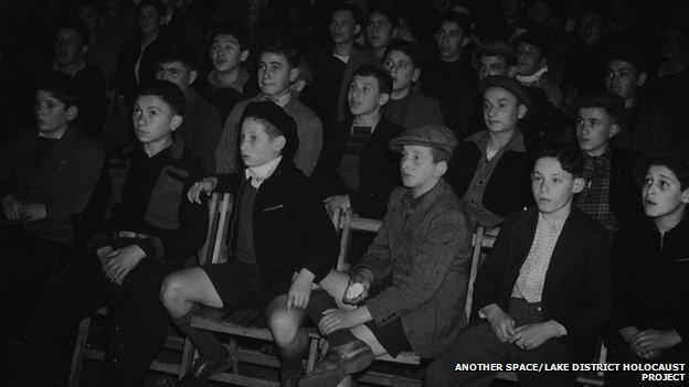 The Boys watch a film in 1945