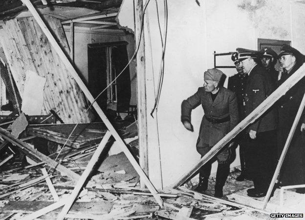 Mussolini and Hitler inspect the wreckage of the conference room after the bomb