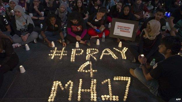 A vigil is held in Kuala Lumpur, Malaysia, 18 July