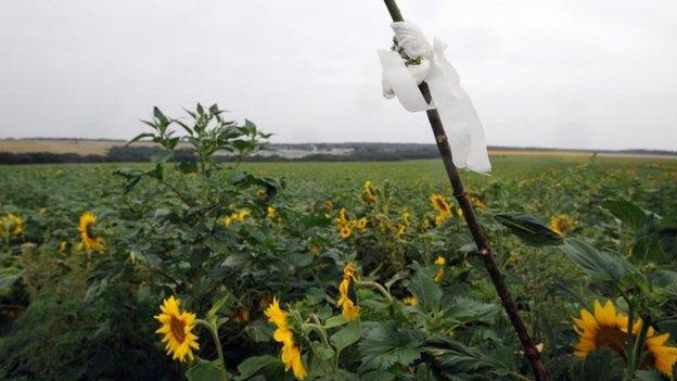 White flags mark the spots where a body lies, 17 July