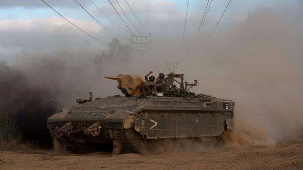 A convoy of Israeli armoured personnel carriers move towards the Gaza border - 18 July 2014