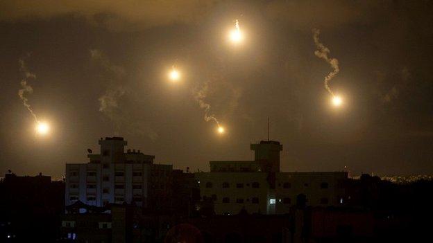 The skies above Gaza are lit up by flares amid the continuation of Israel's ground offensive - 19 July 2014
