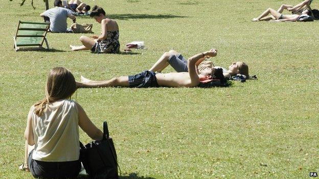 Sunbathers in Regent's Park, London, on 18 July 2014