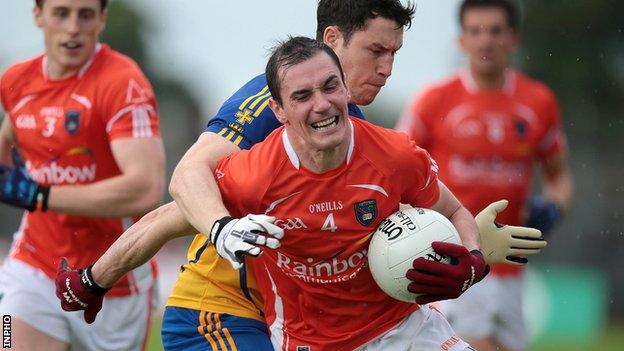 Roscommon's David O'Gara challenges Armagh's Andy Mallon at Dr Hyde Park