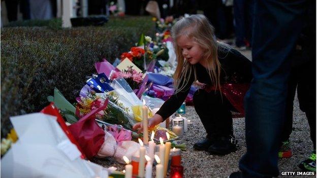 Mourners attend a memorial service held for a family of five killed in the flight MH17 disaster, Melbourne, 20/07/2014