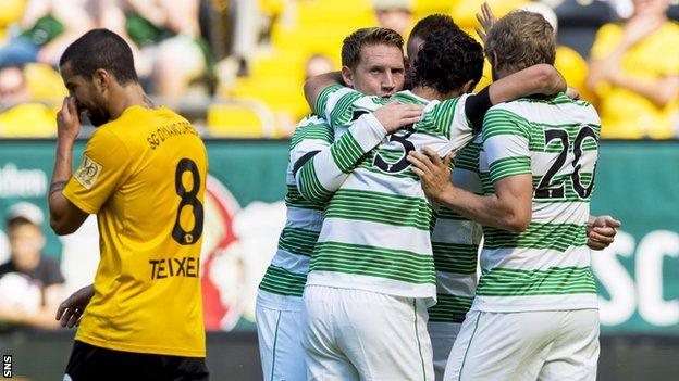 Celtic players celebrating following Kris Commons' goal against Dynamo Dresden