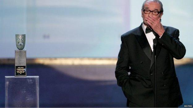 Actor James Garner covers his mouth at the 11th annual Screen Actors Guild awards at the Shrine Auditorium in Los Angeles