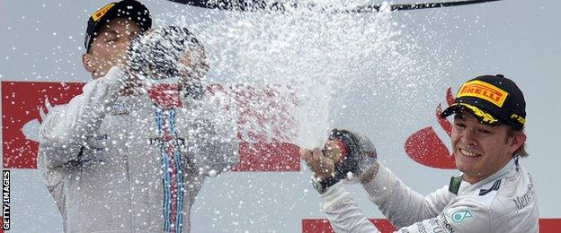 Valtteri Bottas and Nico Rosberg celebrate on the podium at Hockenheim.