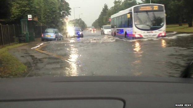 Bus moving through flooded road in Canvey Island