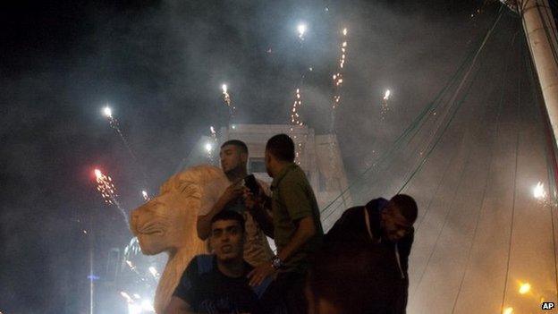 Palestinians launch fireworks during celebrations in the West bank city of Ramallah after Hamas said it had taken an Israeli soldier hostage - 20 July 2014