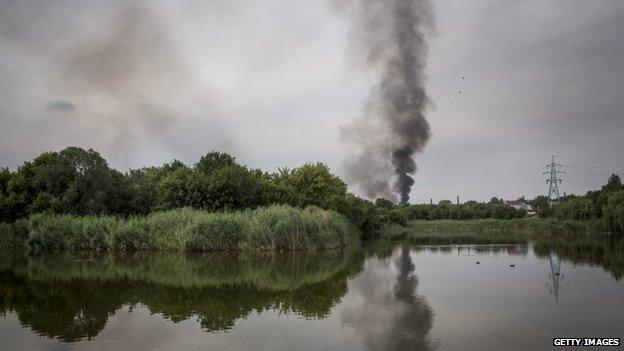 Smoke is seen billowing during fighting between pro-Russia rebels and Ukrainian government troops in Donetsk