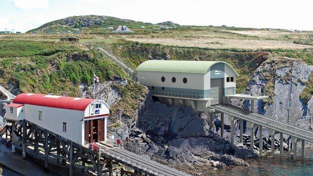 Artist's impression of new RNLI station (in green) alongside the existing boathouse and slipway (in red)