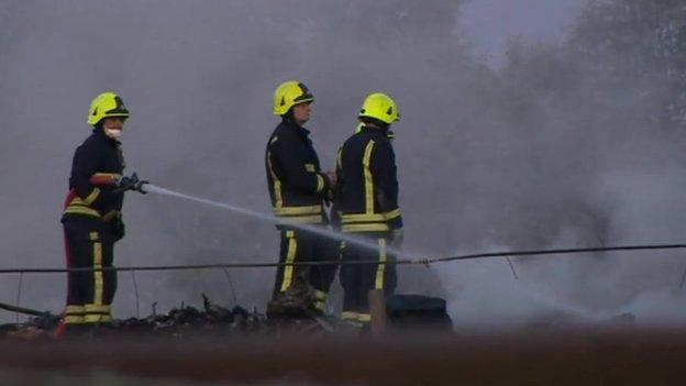 Firefighters work to bring the blaze under control