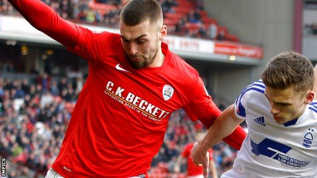 Jack Hunt (left) playing for Barnsley