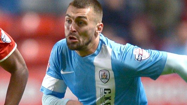 Jack Hunt (left) playing for Barnsley