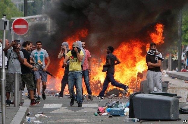 Rioters face police in Sarcelles, northern Paris, 20 July