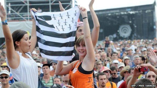 Fans holding a Breton flag at the opening of the Vieilles Charrues festival in Carhaix