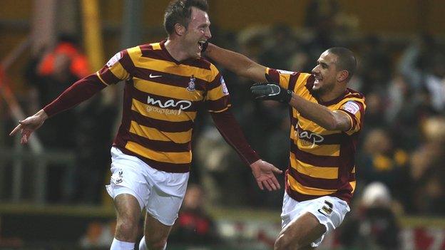 Garry Thompson (left) celebrates scoring against Arsenal with Bradford team-mate James Meredith in 2012