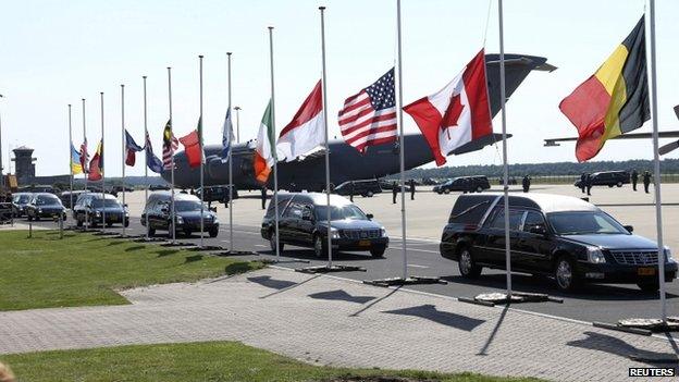 Hearses leave Eindhoven air base. 23 July 2014