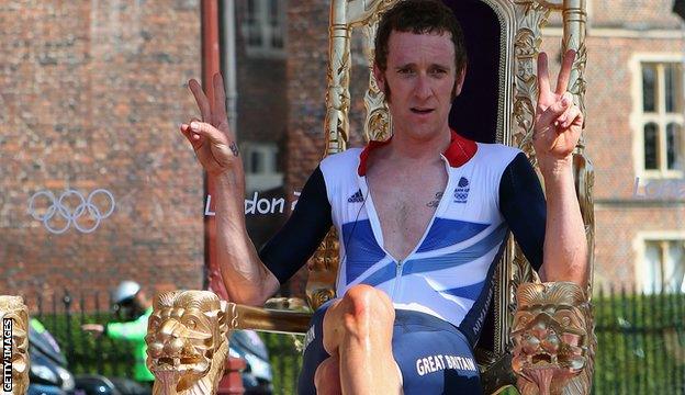 Bradley Wiggins sits on a gold throne as he celebrates his time trial victory in the 2012 Olympics