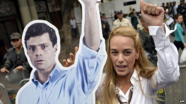 Lilian Tintori holds a poster of her husband, Leopoldo Lopez