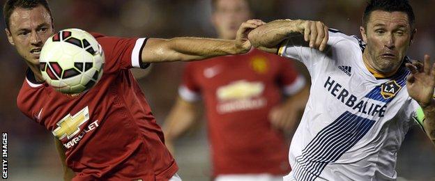 Manchester United's Jonny Evans and Robbie Keane of LA Galaxy