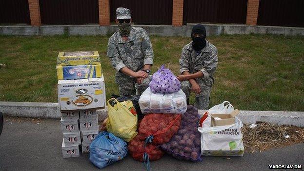 Ukrainian soldiers taking delivery of food supplies