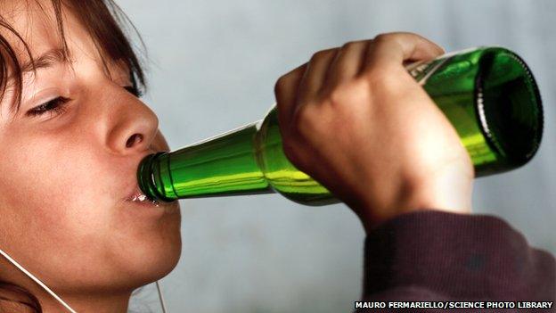 Young person drinking alcohol