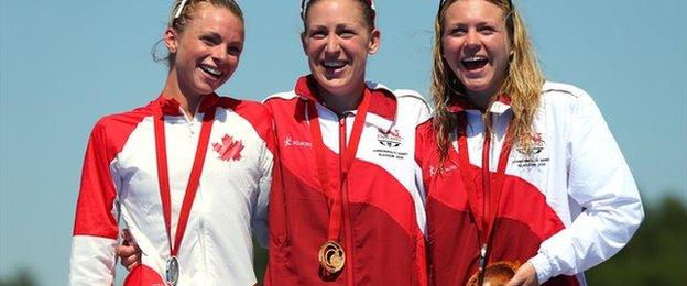 Jodie Stimpson on the podium with her gold medal with Kirsten Sweetland of Canada with silver and Vicky Holland of England with bronze