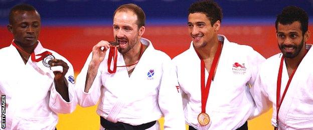 Bronze medalist Razak Abugiri of Ghana, Bronze medalist John Buchanan of Scotland, Gold medalist Ashley McKenzie of England and silver medalist Navjot Chana of India