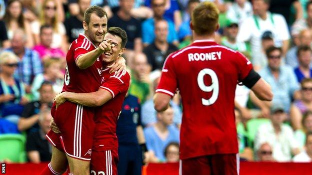 Niall McGinn celebrates after netting Aberdeen's second goal against Groningen