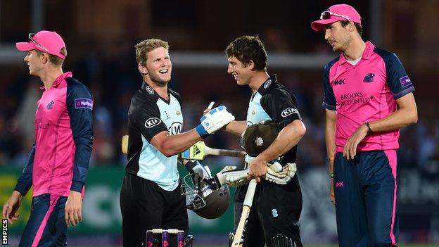 Surrey's Stuart Meaker and Zafar Ansari celebrate Surrey's win