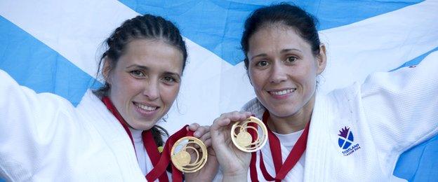 Kimberley and Louise Renicks pose with their Commonwealth Games judo gold medals