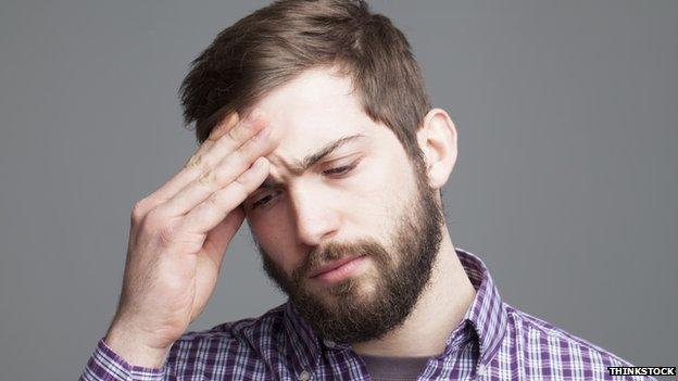 Man holding his head