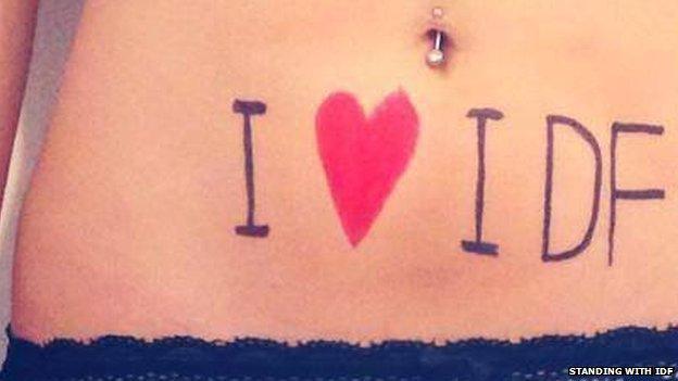 A woman's stomach with the words "I love IDF"